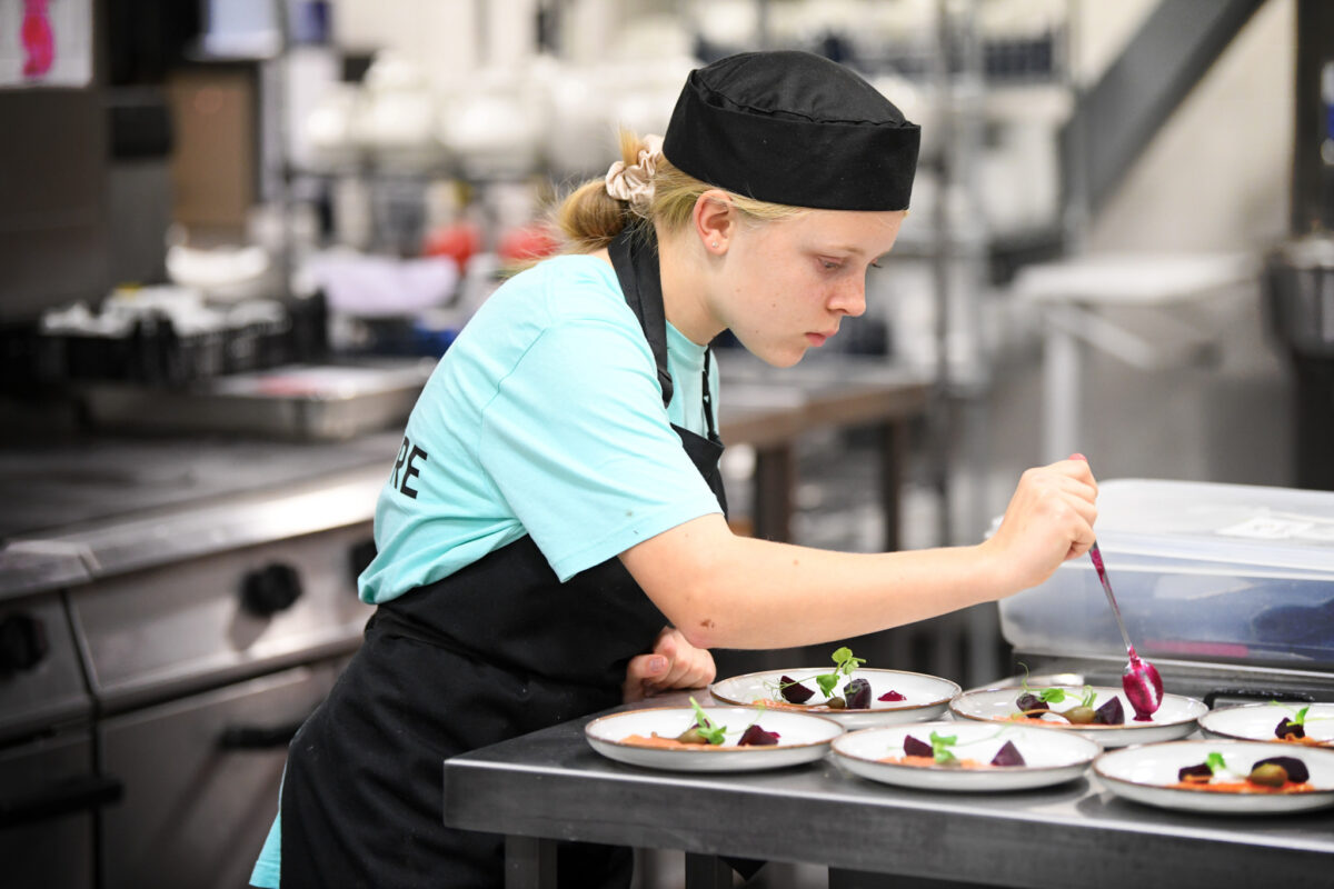 Junior Inspired Chef contestant preparing a dish